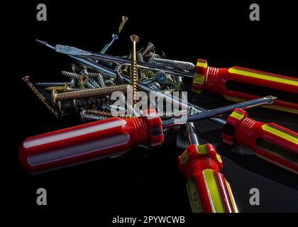 Screwdriver, screws are tools for repairing and connecting wooden parts, especially used by carpenters. Stock Photo