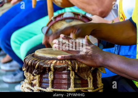 Percussion instrument called atabaque being played in traditional afro-brazilian capoeira presentation, Brasil Stock Photo