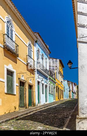 Cobbled streets and slopes and colorful colonial-style historic houses in the Pelourinho district of Salvador, Bahia, Brasil Stock Photo