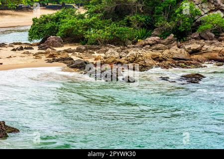 The sea and the rainforest on the beaches of Trindade in Paraty on the south coast of Rio de Janeiro, Brazil, Brasil Stock Photo