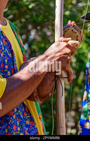 Berimbau player playing his instrument during typical folk festival in the interior of Brazil, Rio de Janeiro, Rio de Janeiro, Brasil Stock Photo