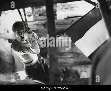 Italy. Friuli-Venezia Giulia, Trieste. October 1953. A patriotic Italian student climbs and pulls the rope in a bell tower. After years of British-American military administration followed by a period of independence as a city-state, in the autumn of 1953 Italian groups try to reunite Trieste with the rest of Italy. Copyright notice: Max Scheler/SZ Photo. Stock Photo