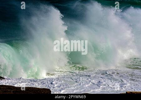 Wave crashing against rocks during storm day at Ipanema beach, Rio de Janeiro, Rio de Janeiro, Rio de Janeiro, Brasil Stock Photo