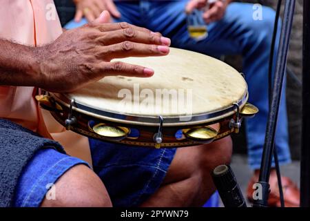 Tambourine being played by a ritimist during a samba performance in Rio de Janeiro, Rio de Janeiro, Rio de Janeiro, Brasil Stock Photo