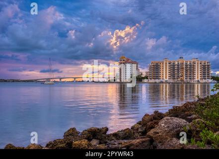 Cloudy sunset over Goldern Gate Point and the John Ringling Causeway Bridge over Sarasota Bay in Sarasota Florida USA Stock Photo