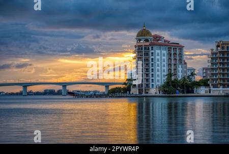 Cloudy sunset over Goldern Gate Point and the John Ringling Causeway Bridge over Sarasota Bay in Sarasota Florida USA Stock Photo