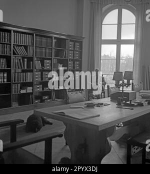 A researcher sitting in a room of a scientific institute in Berlin-Dahlem. Stock Photo