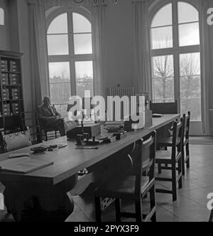 A researcher sitting in a room of a scientific institute in Berlin-Dahlem. Stock Photo