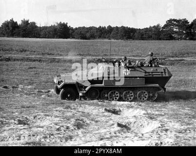 Wehrmacht armored personnel carrier during a demonstration, probably at a military training area in Germany. Photo: Schwahn [automated translation] Stock Photo