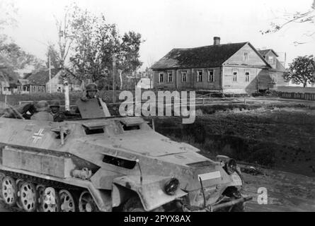 Wehrmacht armored personnel carrier during the fighting near Pskov in the northern section of the Eastern Front. Photo: Tannenberg [automated translation] Stock Photo