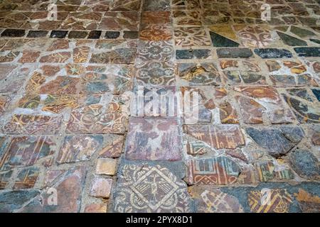 Medieval floor tiles in St Mary's Church in Selborne village, Hampshire, England, UK Stock Photo