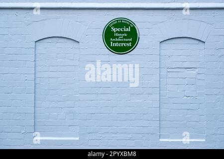 Green plaque; Listed as being of special historic and architectural interest on outside wall at Lyceum Theatre in Crewe Cheshire UK Stock Photo