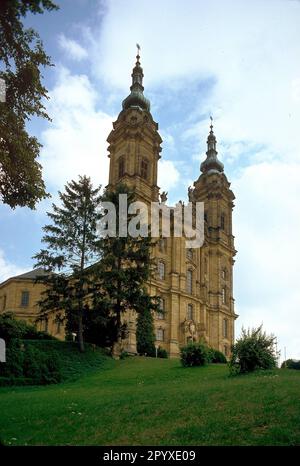 The Basilica of the Fourteen Holy Helpers, which was built opposite to Banz Abbey on the Upper Main, is the most important pilgrimage site in Franconia. It is dedicated to the fourteen Holy Helpers. Designed by Balthasar Neumann, it was built in the Baroque style in the mid-18th century. (undated photo) Stock Photo