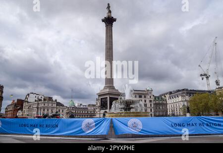 London, UK. 5th May 2023. Banners wrap the fountains at Trafalgar Square on the eve of the coronation of King Charles III. Credit: Vuk Valcic/Alamy Live News Stock Photo