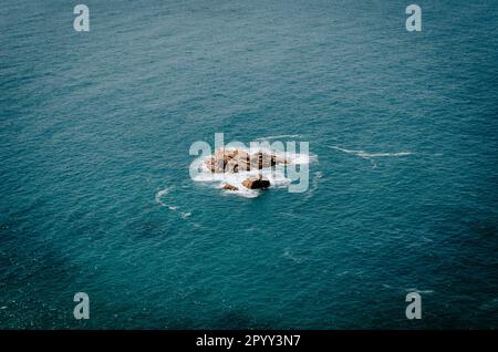 Aerial view of dramatic seascape featuring waves crashing against rocks on the Atlantic Ocean at Cabo da Roca in Portugal Stock Photo