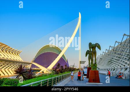 Valencia, Spain - July 17, 2022: Tourists sightseeing winged angles sculptures of bronze. The 'Ciutat de les Arts i les Ciències' was designed by Sant Stock Photo