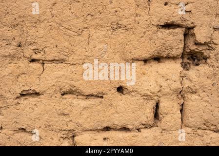 Traditional facade in rural settlements made from bricks and mud Stock Photo