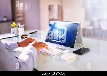 Business Computer Online Update. Software Upgrade Progress Stock Photo