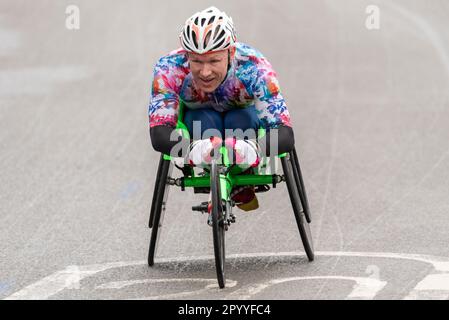 Bret Crossley competing in the TCS London Marathon 2023 passing through Tower Hill, London, UK. Wheelchair athlete. Para athlete. Stock Photo