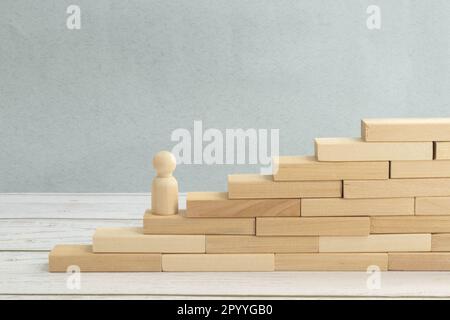 Wooden blocks in form of ladder upstairs red on dove background. Most important factors for career development concept Stock Photo