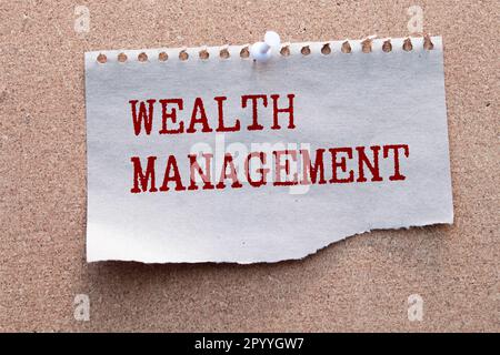 Wealth management is shown using a text and pictures of dollars. Stock Photo