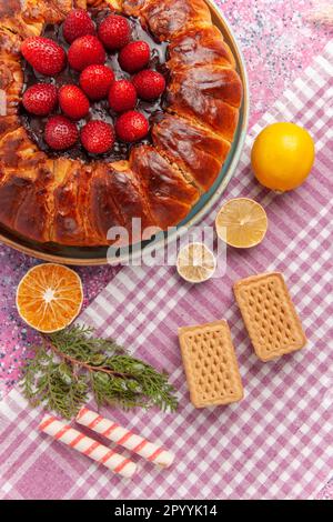 top view yummy strawberry pie with waffles on pink background tea biscuit cake sugar cookie sweet Stock Photo