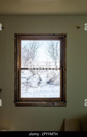 DIY window insert install in old house with wintery snow and trees in ...