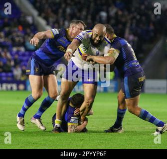 Warrington, Cheshire, England 5th May 2023. Warrington's Sam Kasiano breaking through the line, during Warrington Wolves V Wakefield Trinity , at the Halliwell Jones Stadium, in the Betfred Super League Stock Photo