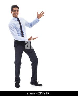 This is your space. Portrait of a handsome young businessman gesturing towards the copy space and smiling. Stock Photo
