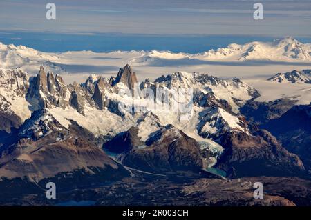 aerial view of mountains Cerro Torre (left), Fitz Roy (middle), volcano Lautaro (right) and the southern patagonian ice field, Patagonia, between Chil Stock Photo