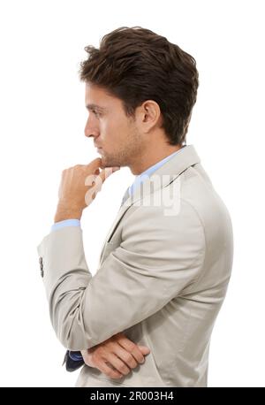 Whats his next move. Studio shot of a handsome young businessman thinking isolated on white. Stock Photo