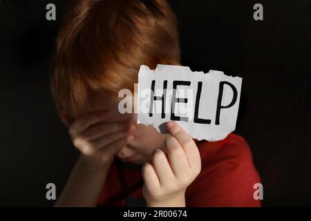 Cruel concept word on paper background Stock Photo - Alamy