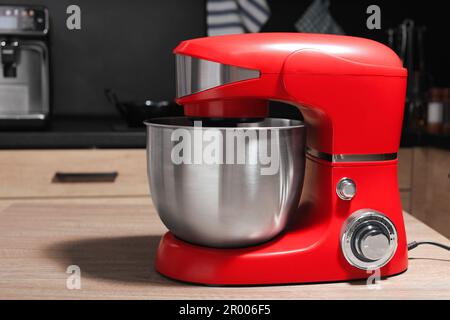 https://l450v.alamy.com/450v/2r006f5/modern-stand-mixer-on-wooden-table-in-kitchen-2r006f5.jpg