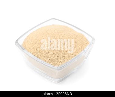 Granulated yeast in glass bowl isolated on white Stock Photo