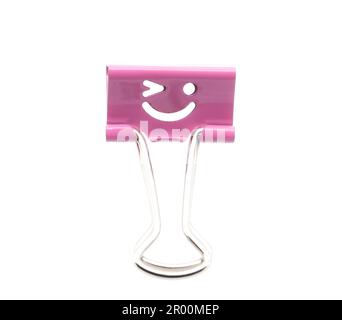 Smile pink binder clip isolated on white background Stock Photo