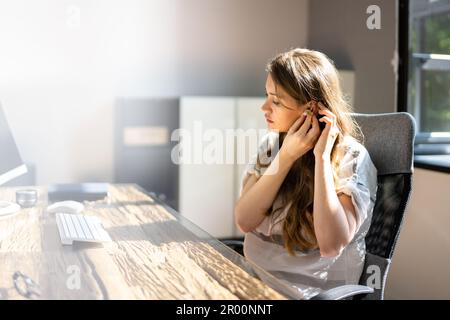 Hearing Aid And Audiology. Woman With Disability Stock Photo