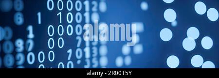 Blue digital binary data on computer screen with bokeh. Abstract information technology background. Digital binary code matrix background. Close-up wi Stock Photo