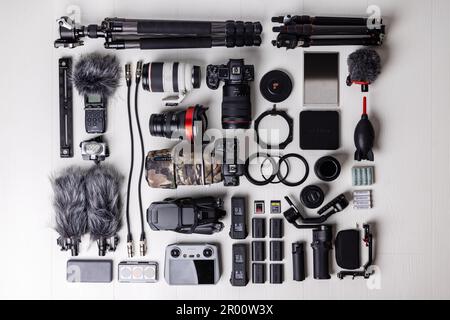 Varna, Bulgaria 13 March 2023, Videography,  photography, sound equipment - top down view of professional drone, dslr camera, lenses, filters, microph Stock Photo