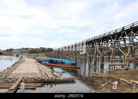 Mon Bridge crossing Songkalia River, the Thailand's longest wooden bridge, Sangkhla Buri District in Kanchanaburi, Thailand Stock Photo