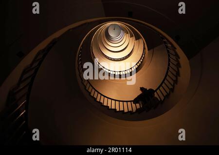 Spiral staircase in a tall multi-floor house, in the form of a 'golden ratio', architecture, concert Stock Photo