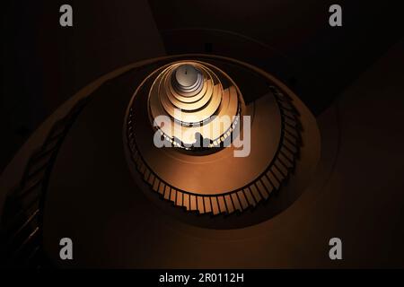 Spiral staircase in a tall multi-floor house, in the form of a 'golden ratio', architecture, concert Stock Photo