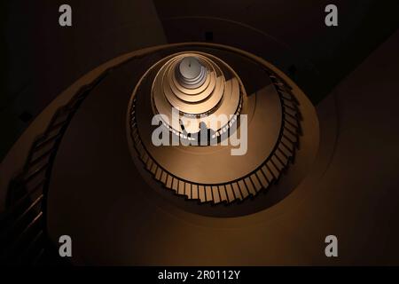 Spiral staircase in a tall multi-floor house, in the form of a 'golden ratio', architecture, concert Stock Photo