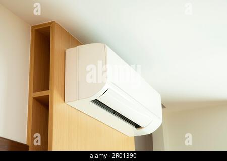 Split air conditioner installed on wooden wall Stock Photo - Alamy
