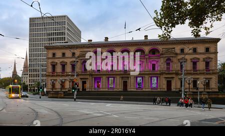 Melbourne CBD Saturday, the Victorian Parliament House building on Spring Street lights purple ahead of the Coronation of King Charles III May. 6, 2023. corleve/Alamy Live News Stock Photo