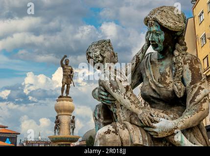 Skopje, North Macedonia.The Mothers of Macedonia Fountain statues with statue of Philip II of Macedon, father of Alexander the Great at behind. Stock Photo