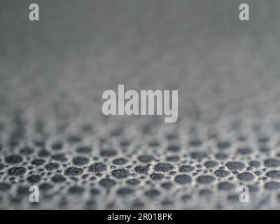 The dot pattern on the surface texture of synthetic leather Stock Photo