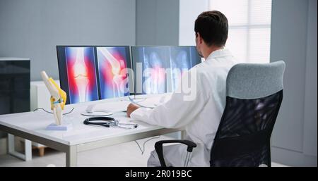 Dentist Using Computer Technology Dental Software For Teeth Xray Stock Photo