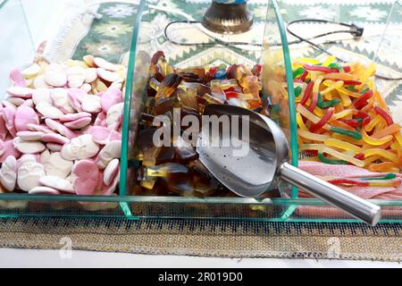 Various chewing marmalade in glass box at market Stock Photo