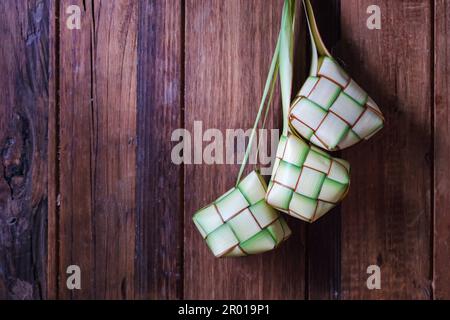Ketupat is traditional food popular in Indonesia and Malaysia during of the celebration Islamic Eid Mubarak Stock Photo
