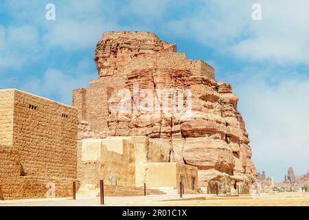 Al Ula old town ruined huts with city castle on the rock, Medina province, Saudi Arabia Stock Photo